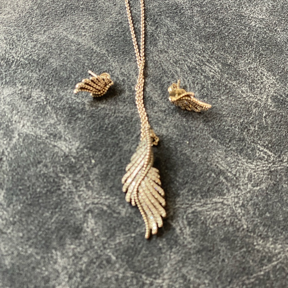 Pandora sterling silver wing earrings and necklace set.